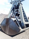 Clamshell bucket in the cargo port. Bucket for loading coal