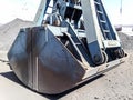 Clamshell bucket in the cargo port. Bucket for loading coal