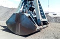 Clamshell bucket in the cargo port. Bucket for loading