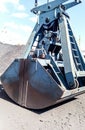 Clamshell bucket in the cargo port. Bucket for loading