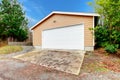 Clapboard siding garage with drive way