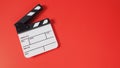 Clapper board or movie slate on red background.it use in video production and film industry Royalty Free Stock Photo