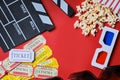 Clapper board, movies tickets and popcorn top view Royalty Free Stock Photo