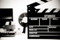 Clapper board with vintage movie editing desktop in black and white Royalty Free Stock Photo