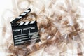 Clapper on 35mm movie unrolled filmstrip texture