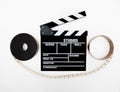 Clapper and 35mm reel isolated