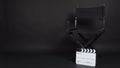 Clapperboard or clap board or movie slate with director chair use in video production ,film, cinema industry on black background Royalty Free Stock Photo