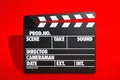 Clapperboard on color background. Modern cinema