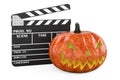 Clapperboard with Halloween pumpkin, 3D rendering