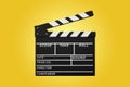 clapperboard isolated on yellow