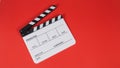 Clapperboard or movie slate is isolated on red background. it use in video production and film industry Royalty Free Stock Photo