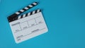 Clapperboard or movie slate .It is use in video production ,film, cinema industry on blue background Royalty Free Stock Photo