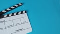 Clapperboard or movie slate .It is use in video production ,film, cinema industry on blue background Royalty Free Stock Photo