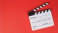 Clapperboard or movie slate. it use in video production ,film, cinema industry on red background Royalty Free Stock Photo