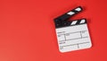 Clapperboard or movie slate. it use in video production ,film, cinema industry on red background Royalty Free Stock Photo
