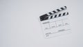 Clapperboard or movie slate use in video production, film and  cinema industry. It`s white color on paper background Royalty Free Stock Photo