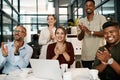 Clapping and cheering business people happy at a design conference. Diverse creative group of designers excited by a Royalty Free Stock Photo