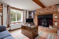 Chic traditional cottage living room with fireplace