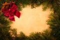 Claret bow on old paper, Christmas decoration