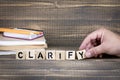 Clarify. Wooden letters on the office desk Royalty Free Stock Photo