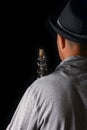 Clarinet in the hands of a man on a black background Royalty Free Stock Photo