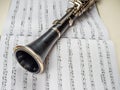 Clarinet lays over the book with notes Royalty Free Stock Photo