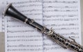 Clarinet lays over the book with notes Royalty Free Stock Photo