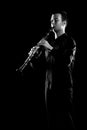 Clarinet player classical musician  on black. Clarinetist playing music instrument Royalty Free Stock Photo