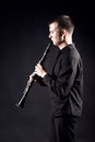 Clarinet player profile. Musician playing woodwind Royalty Free Stock Photo