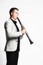 Clarinet player classical musician on white.