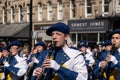 Clarinet Players Parading in a Town Centre.