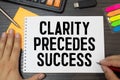 Clarity, Precedes, Success write on sticky notes  on office desk Royalty Free Stock Photo