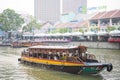 CLARK QUAY, SINGAPORE - OCTOBER 11, 2015: tourist boat cruising Royalty Free Stock Photo