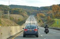 Clark Summit, Pennsylvania, U.S - October 20, 2020 - Traffic on PA Turnpike surrounded by striking color of fall foliage