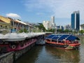 Clarke Quay marine style eatery with dining on docked boat and sailor design on Singapore River