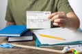 Concept image showing a kid holding a COVID-19 vaccination record card