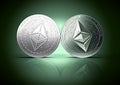 Clash of Ethereum and Ethereum classic coins on a gently lit reflective dark green background with copy space.