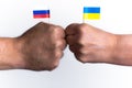 Clash of fists with the flags of Ukraine and Russia. Power struggle concept, conflict of interest, war, sanctions, cold war