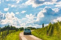 Clasic Mercedes car driving over road through vineyards landscape