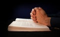 Clasped hands on a bible Royalty Free Stock Photo