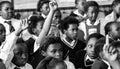 African children in a classroom, raising their hands in the Primary school of Soweto in South Africa Royalty Free Stock Photo