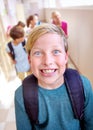 Class clown. Closeup portrait of a young schoolboy pulling a face.