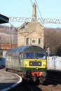 Class 47 diesel-electric locomotive in two tone green livery carrying original number D1924 leaving Carnforth station on 28th Royalty Free Stock Photo