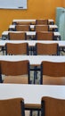 class of elemantary school desk chairs board empty Royalty Free Stock Photo