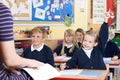 Class Of Elementary School Pupils Answering Question Royalty Free Stock Photo