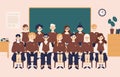 Class group portrait. Smiling girls and boys dressed in school uniform or pupils sitting in classroom against chalkboard