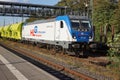 A Bombardier Class 187 locomotive is waiting with a freight train for departure at Marburg station.