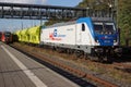 A Bombardier Class 187 locomotive is waiting with a freight train for departure at Marburg station.