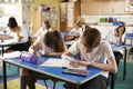 Class of primary school kids studying during a lesson, close up Royalty Free Stock Photo
