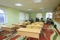 Class-room of the medrese: school desks, shelves with books Muslim boys standing. Islamic culture centre, Kyiv, Ukraine